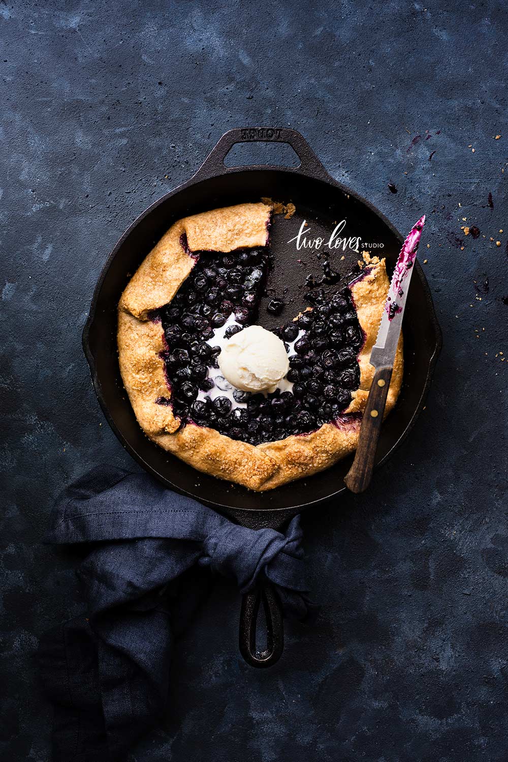 Cast iron skillet blueberries tart and ice-cream 