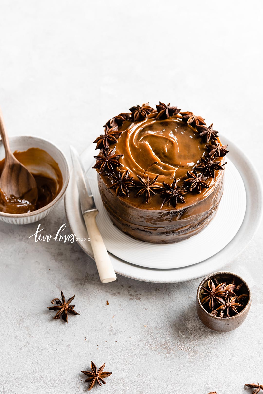 A caramel cake topped with a star anise ring
