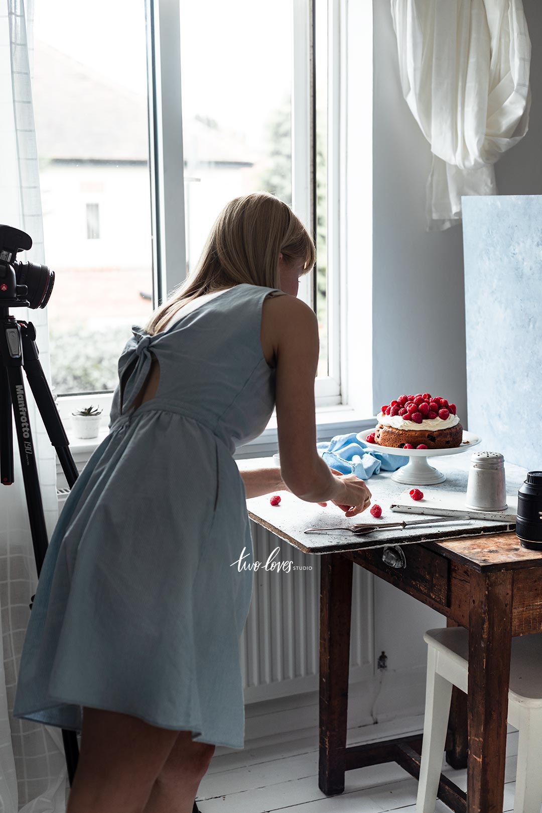 Bea working on a cake set up behind the hind the scenes shot.