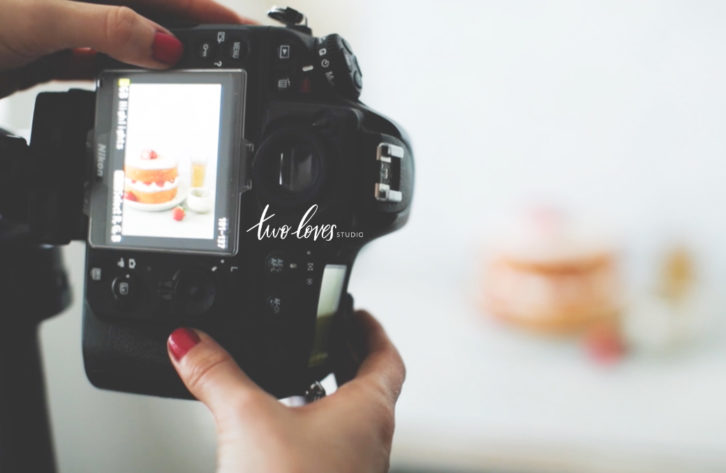 Back of a camera looking at a shot taken of a cake.