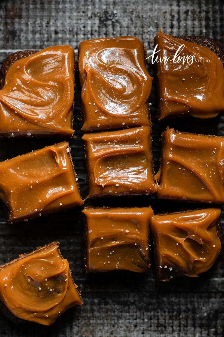 Caramel topped brownie cake cut into slices. 