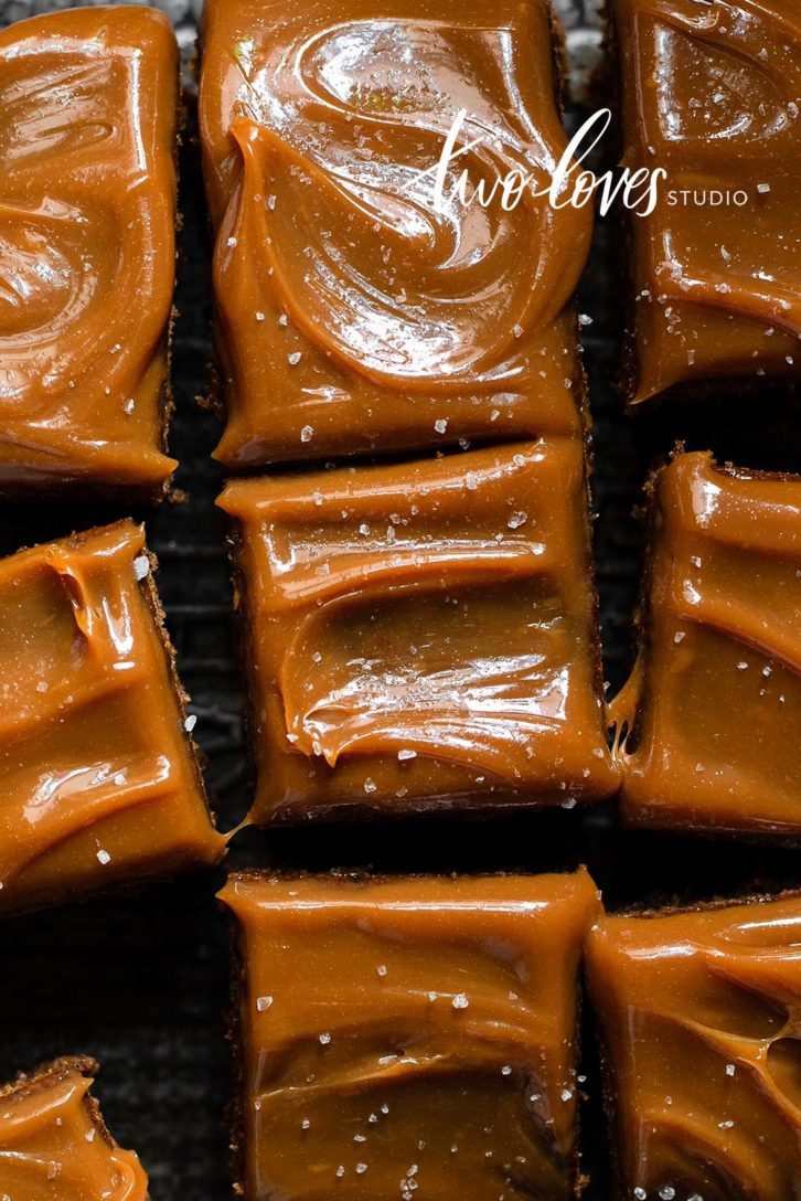 Caramel topped brownie cake cut into slices. 