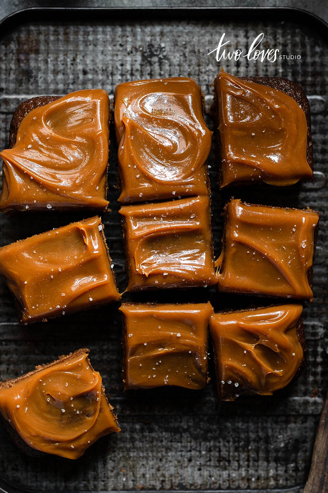 Caramel topped brownie cake cut into slices. 