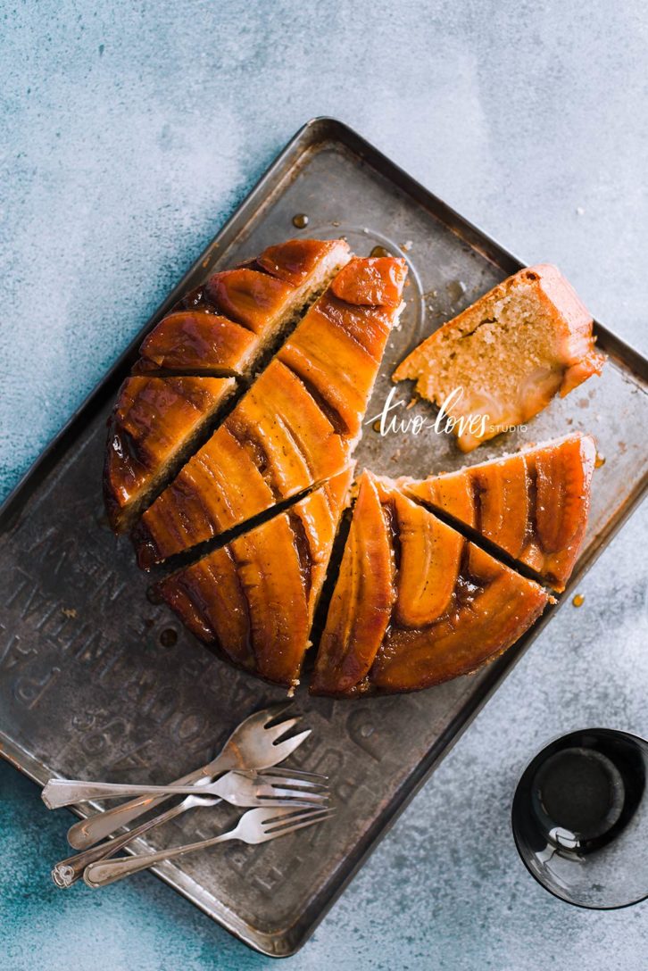 A circle banana cake cut into slices.  