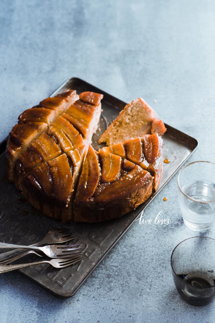 A circle banana cake cut into slices 