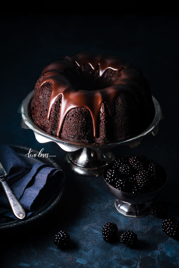 Chocolate bundt cake with chocolate frosting and blackberries