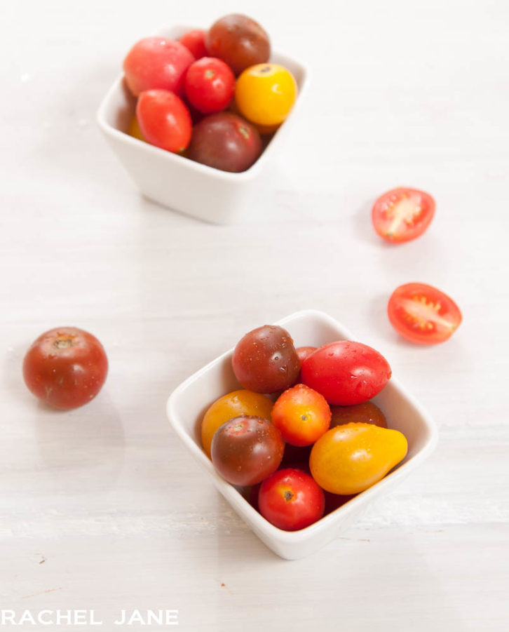 A photo from 2012 with two white bowls and red tomatoes inside. 