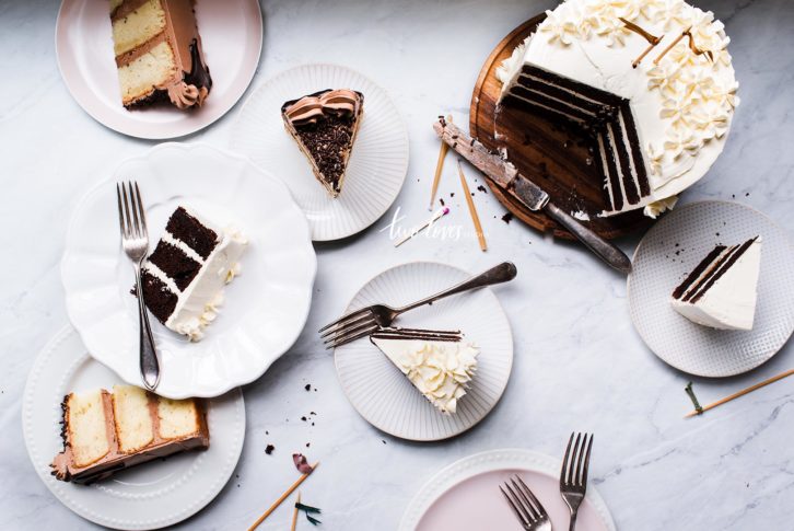 Cake slices in a assortment of plates.