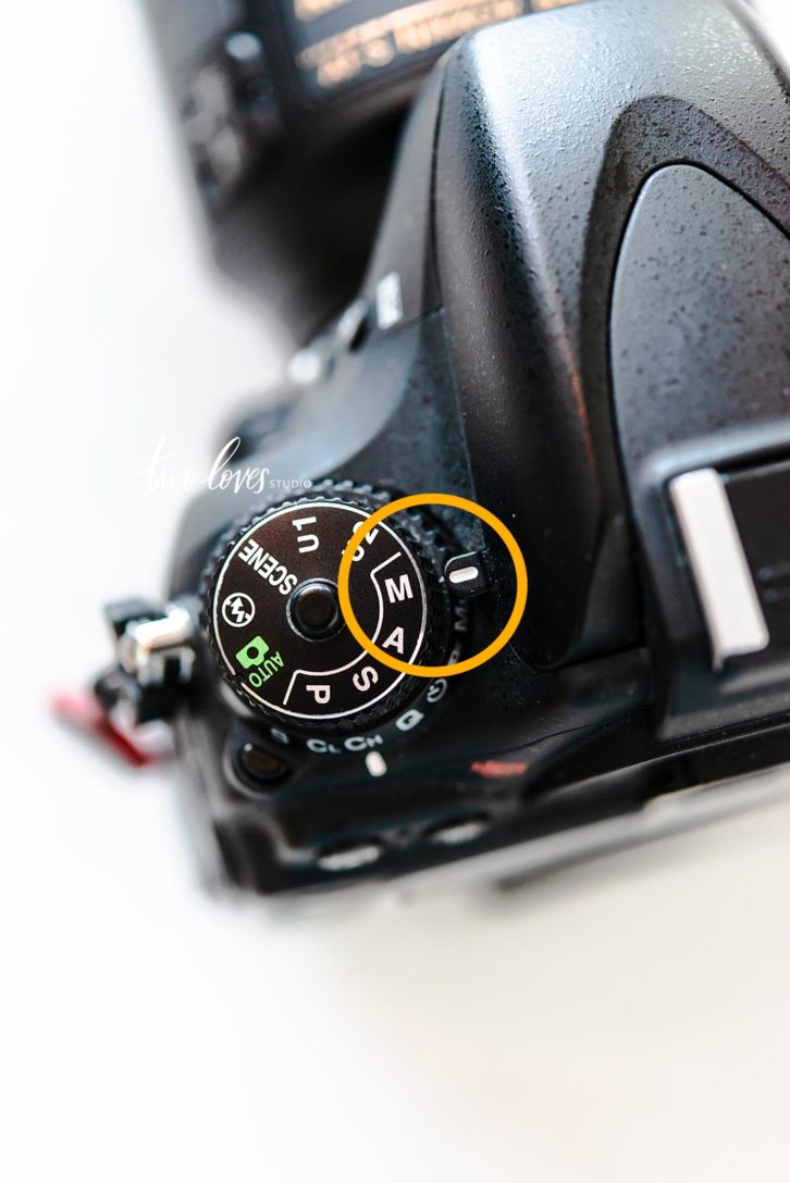 Close up photo of a camera M button