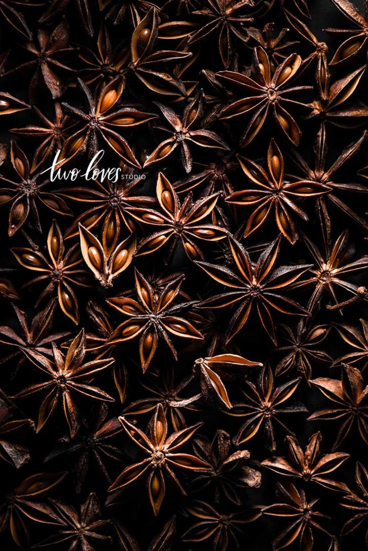 composition in food photography showing a close up shot of many star anise.