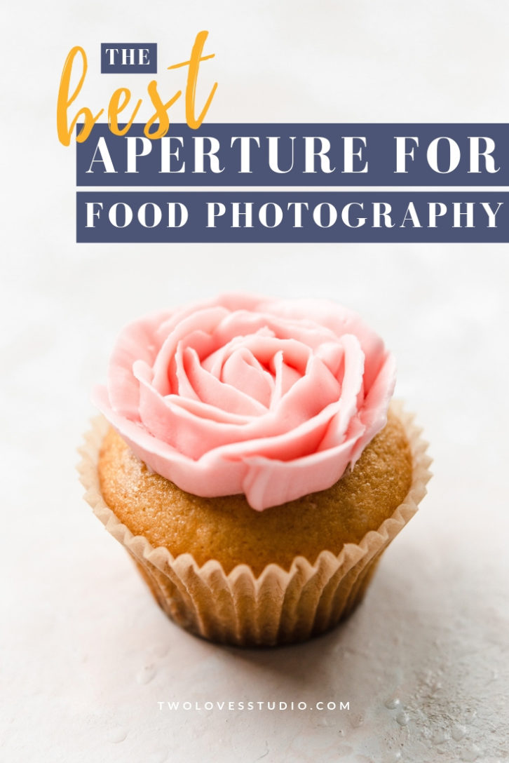 Cupcake with a pink rose piped ontop. Aperture for food photography.