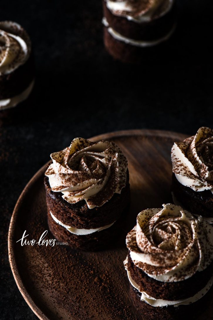 Black small round cakes with white icing
