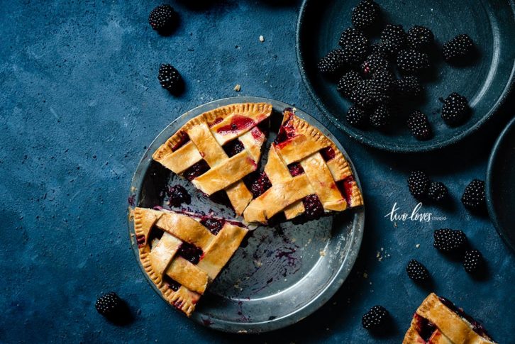 Blackberry pie cut into pieces 