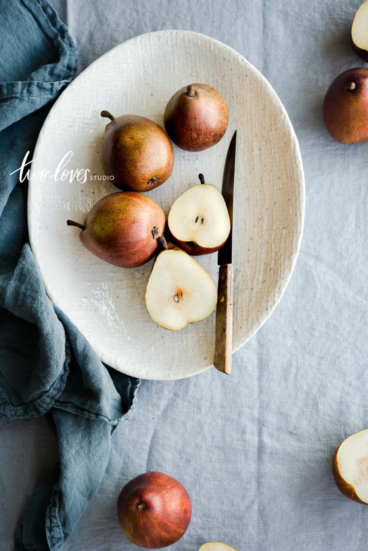 A bowl of pears cut in half