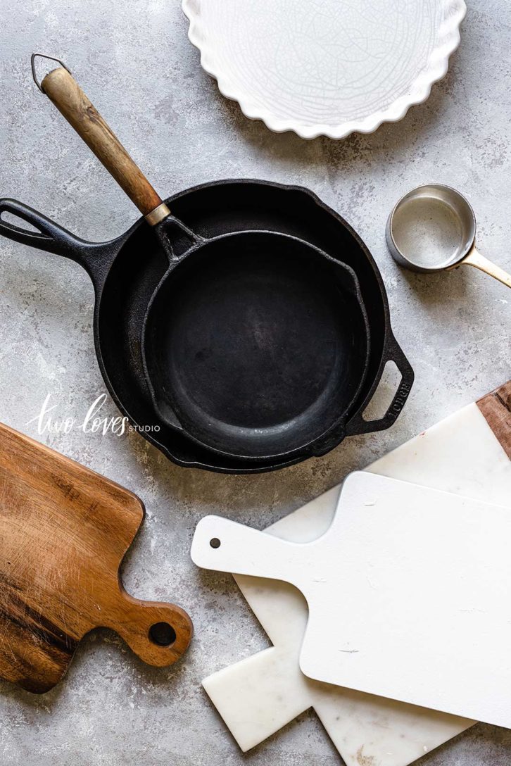 Cast iron pans with chopping boards.