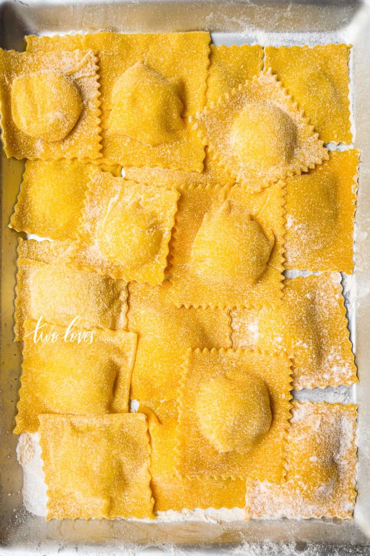 Uncooked pasta cut into squares with a flower dusting.