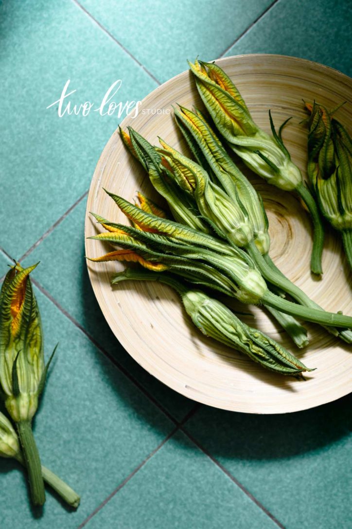 A plate of green vegetables on a bowl.