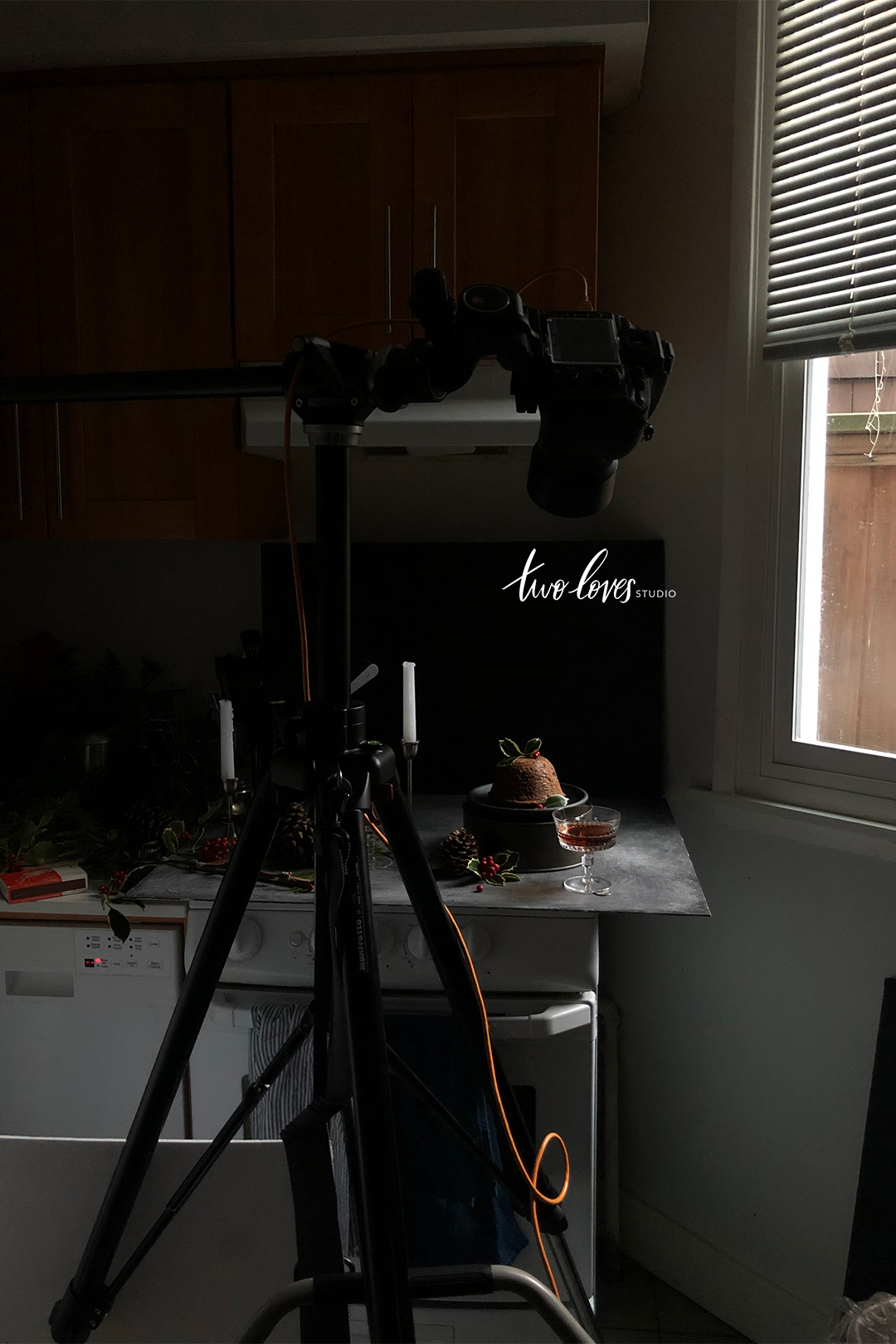 Low light food photography behind the scenes setup shooting a Christmas pudding.