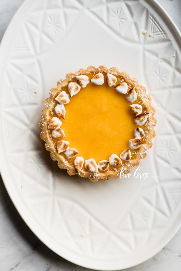 Lemon meringue wreath on a white oval plate.