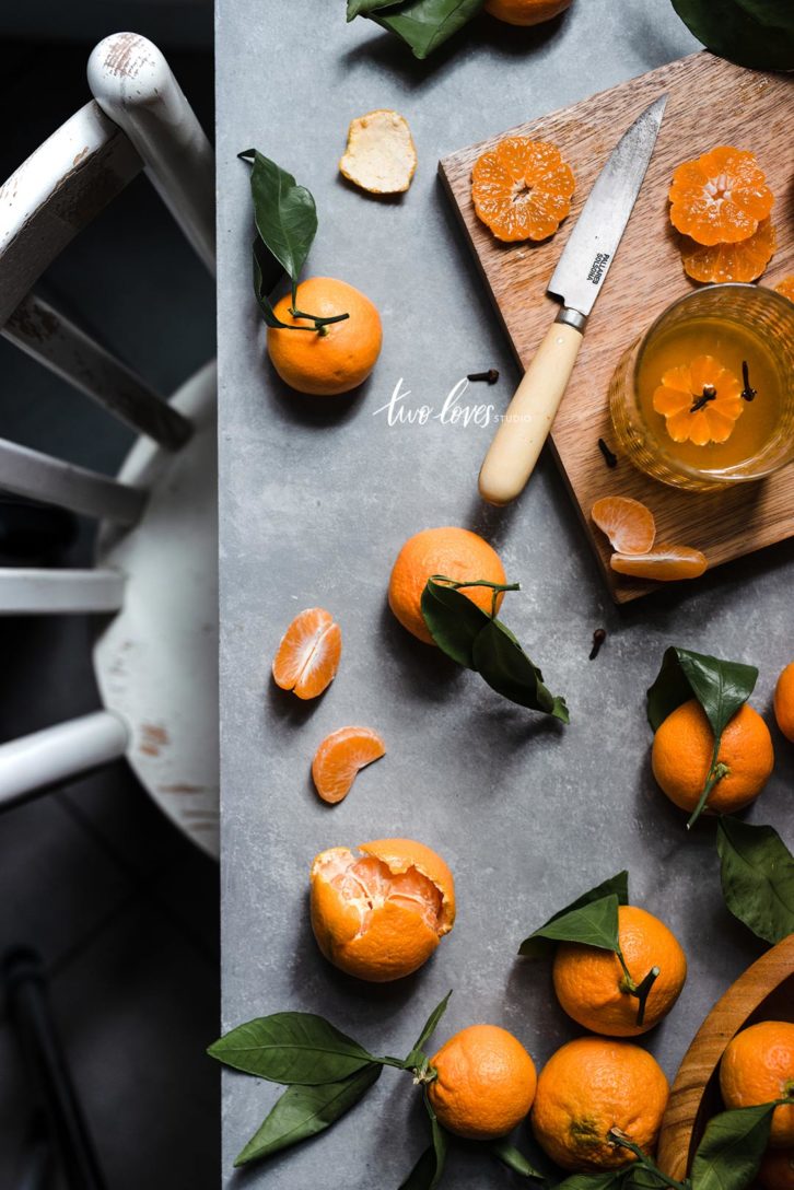 Clementine flatlay overhead with white chair.