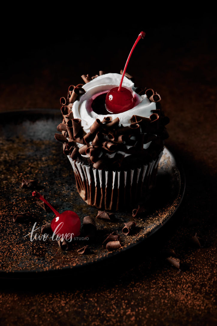 Black forest cupcake showing the food photography gear needed for this shot.