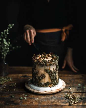 Tall cake being cut by Betty Shin Binon.
Food photo shot with Canon EF 50mm f/1.2L USM.