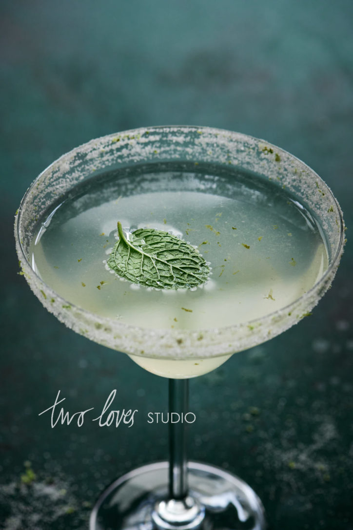 A macro shot of a cucumber margarita with a mint leaf. Shot with the 105mm macro. An article about which lens for food photography.