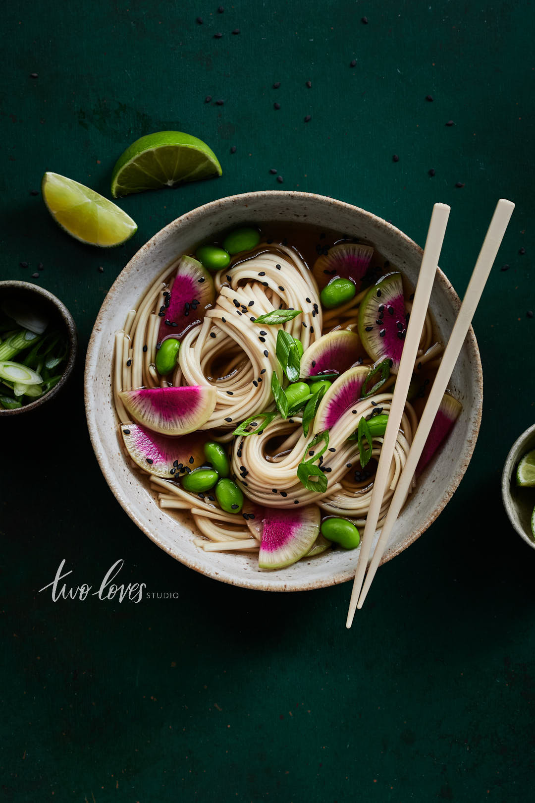 Ramen bowl with watermelon radish halves.