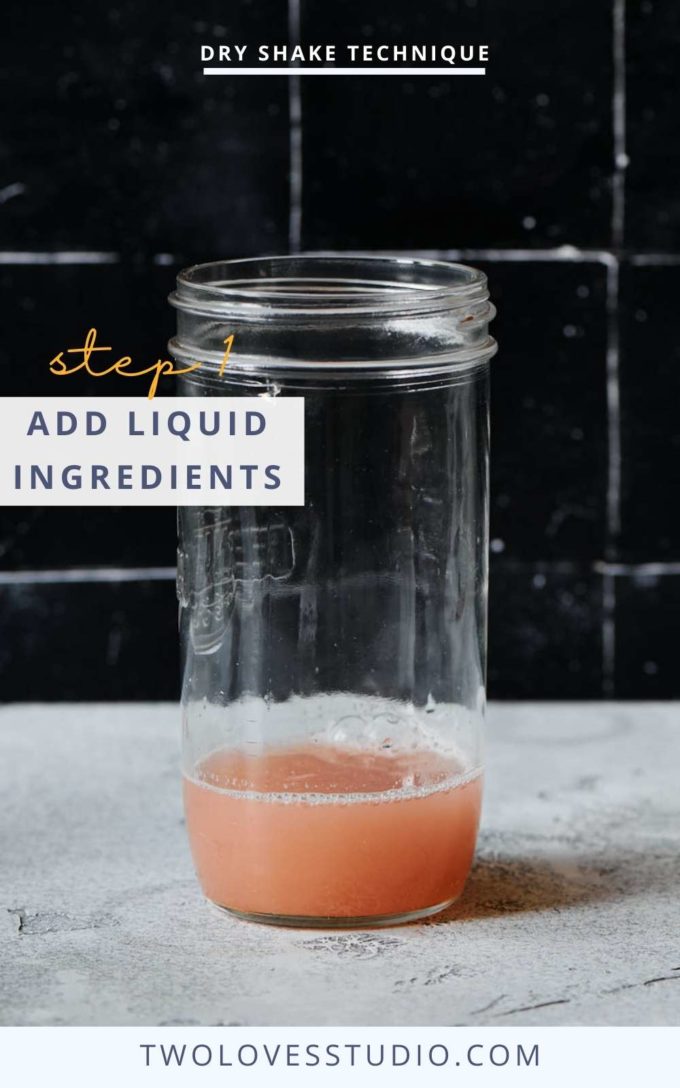 Step by step example. Cocktail liquid in a mason jar on a dark background. No lid. 