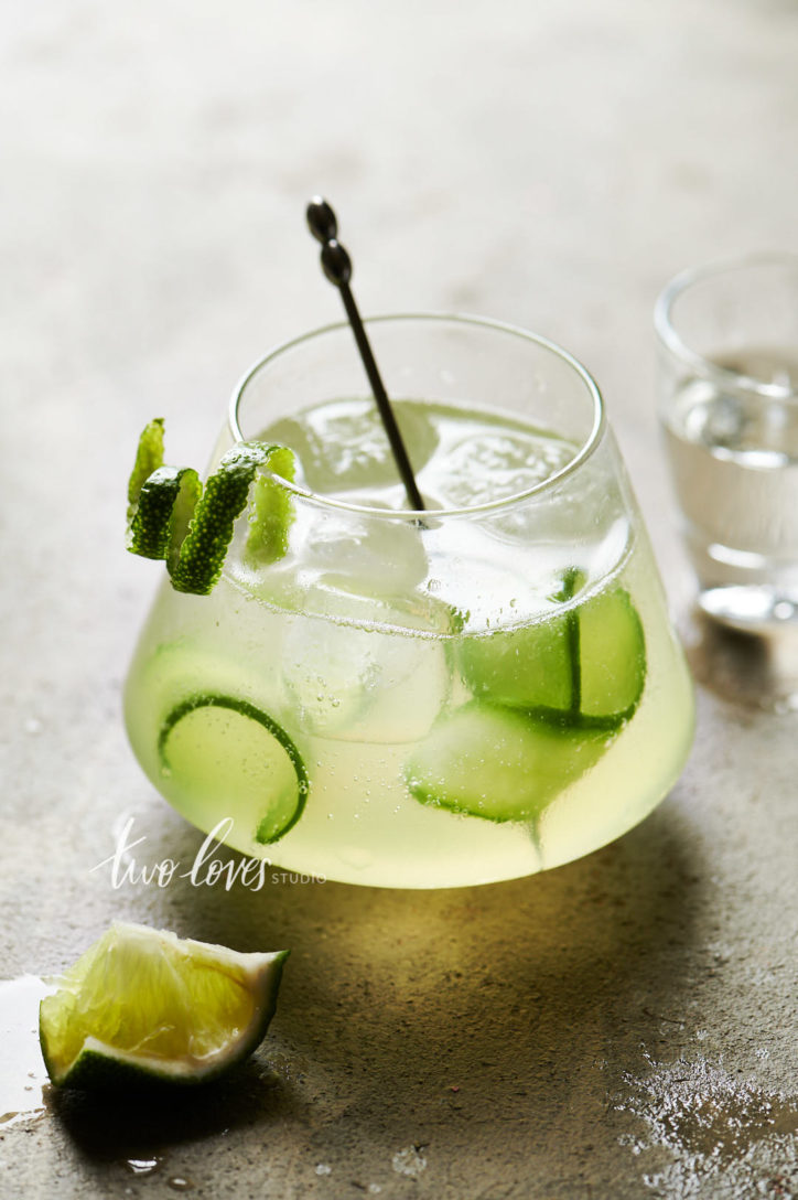 Cucumber and lime cocktail with a single lime swirl garnish.