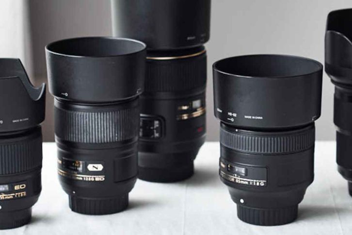Image of a set of different lenses. Picking the right lens and aperture is the key to getting blurry backgrounds in food photography.