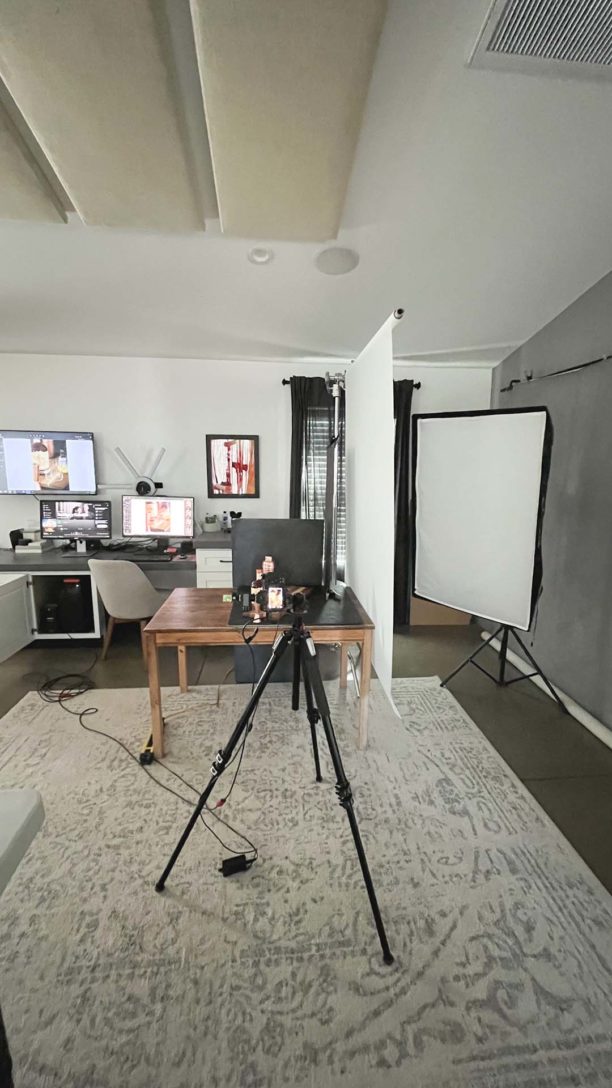 Home set up showing a table with props, camera and lighting box and diffuser sheet. 