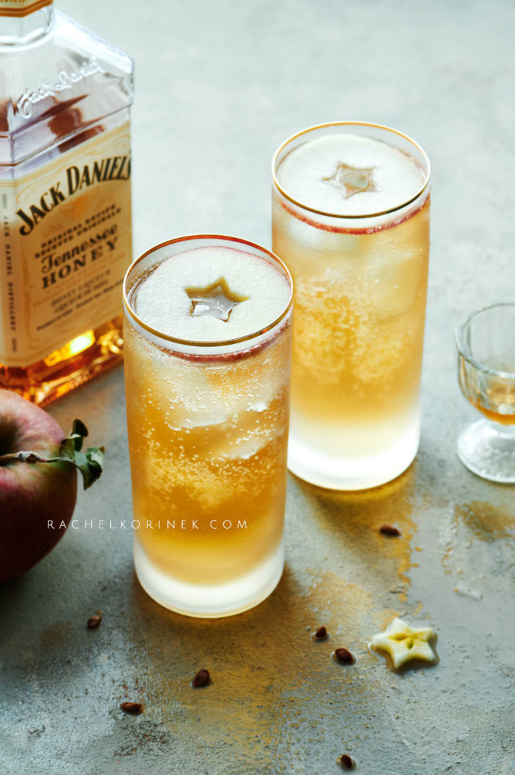 Bubble textures in two tall glasses using honey whiskey.