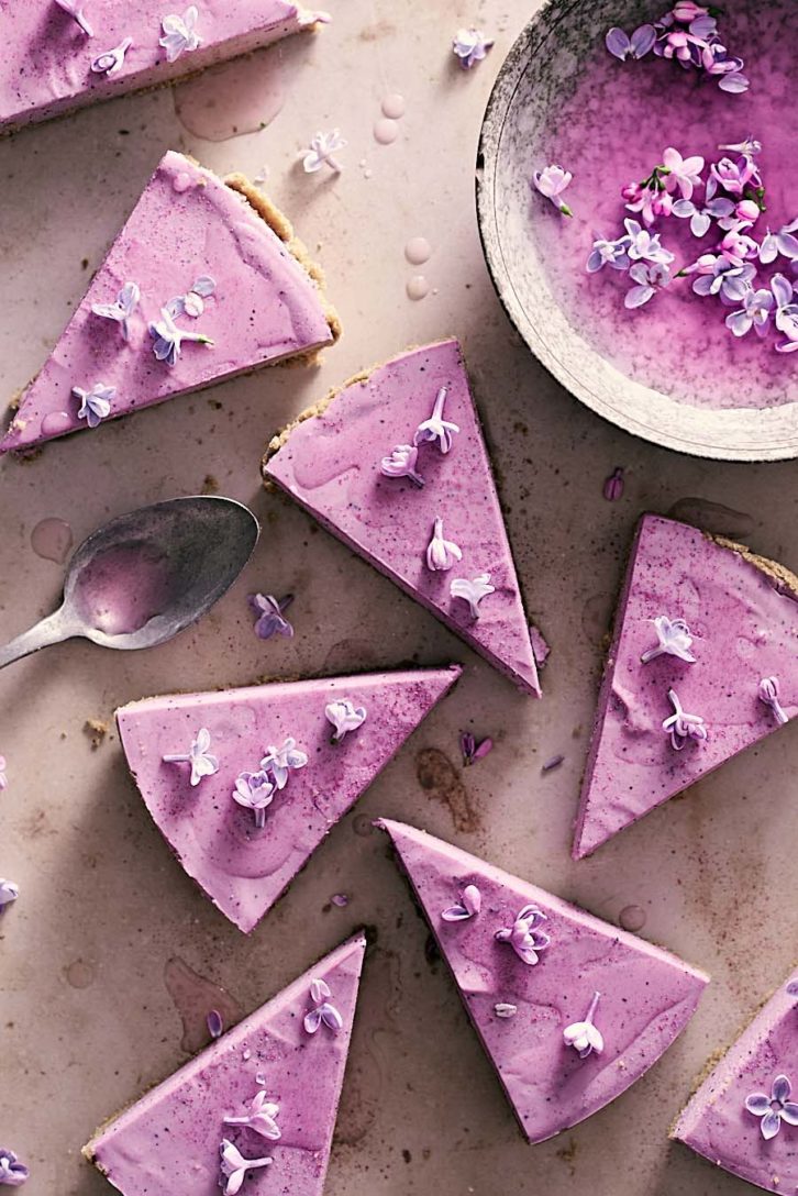 slices of blueberry lilac cheesecake.