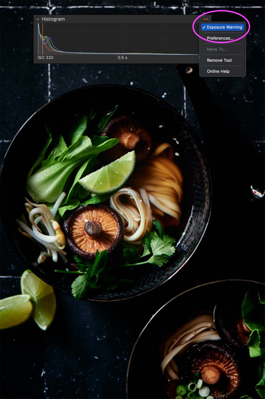 Flatlay image of a asian noodle bowl with mushrooms, bokchoy and mint.