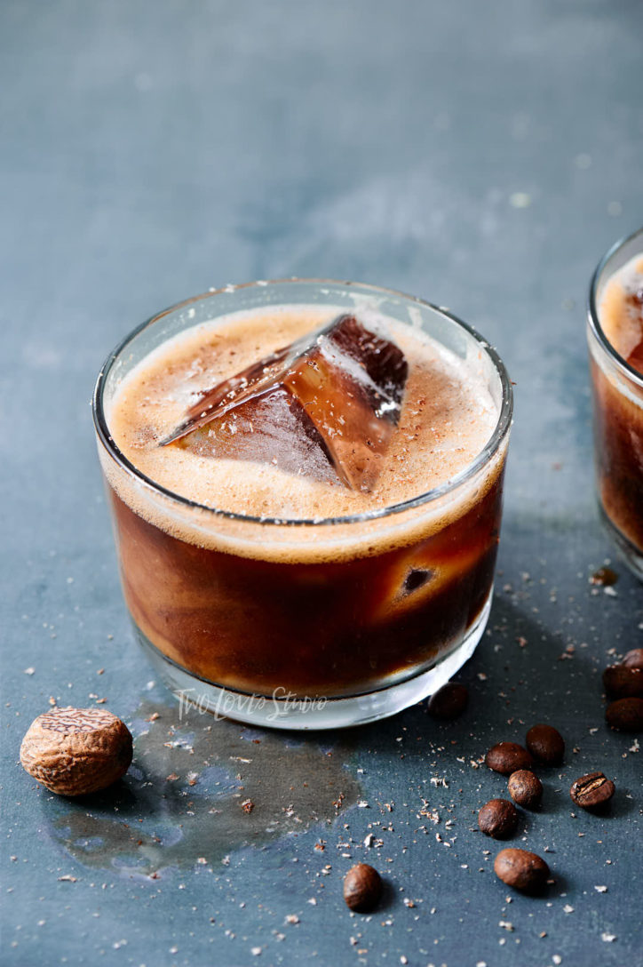 A shot of a small cocktail glass with a non-alcoholoic iced coffee cocktail.