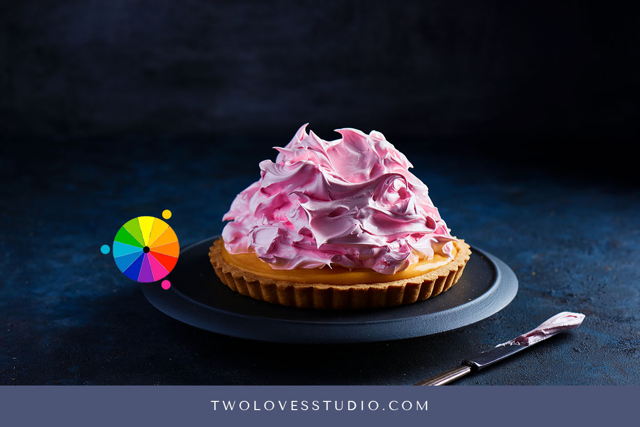 Lemon yellow tart with pink meringue on top.