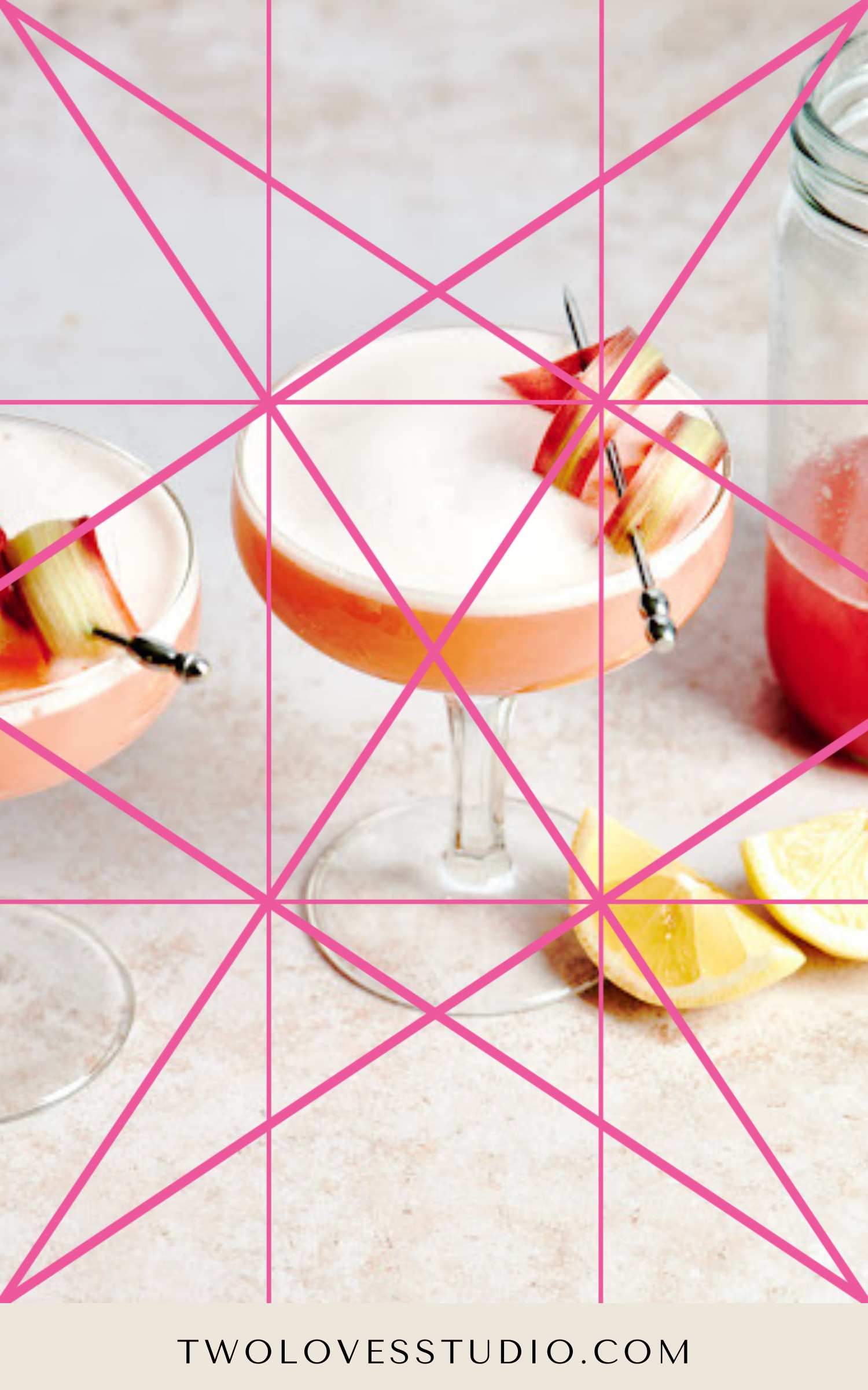 Dynamic symmetry lines across a soft pink background with a rhubarb cocktail and lemon wedges.  