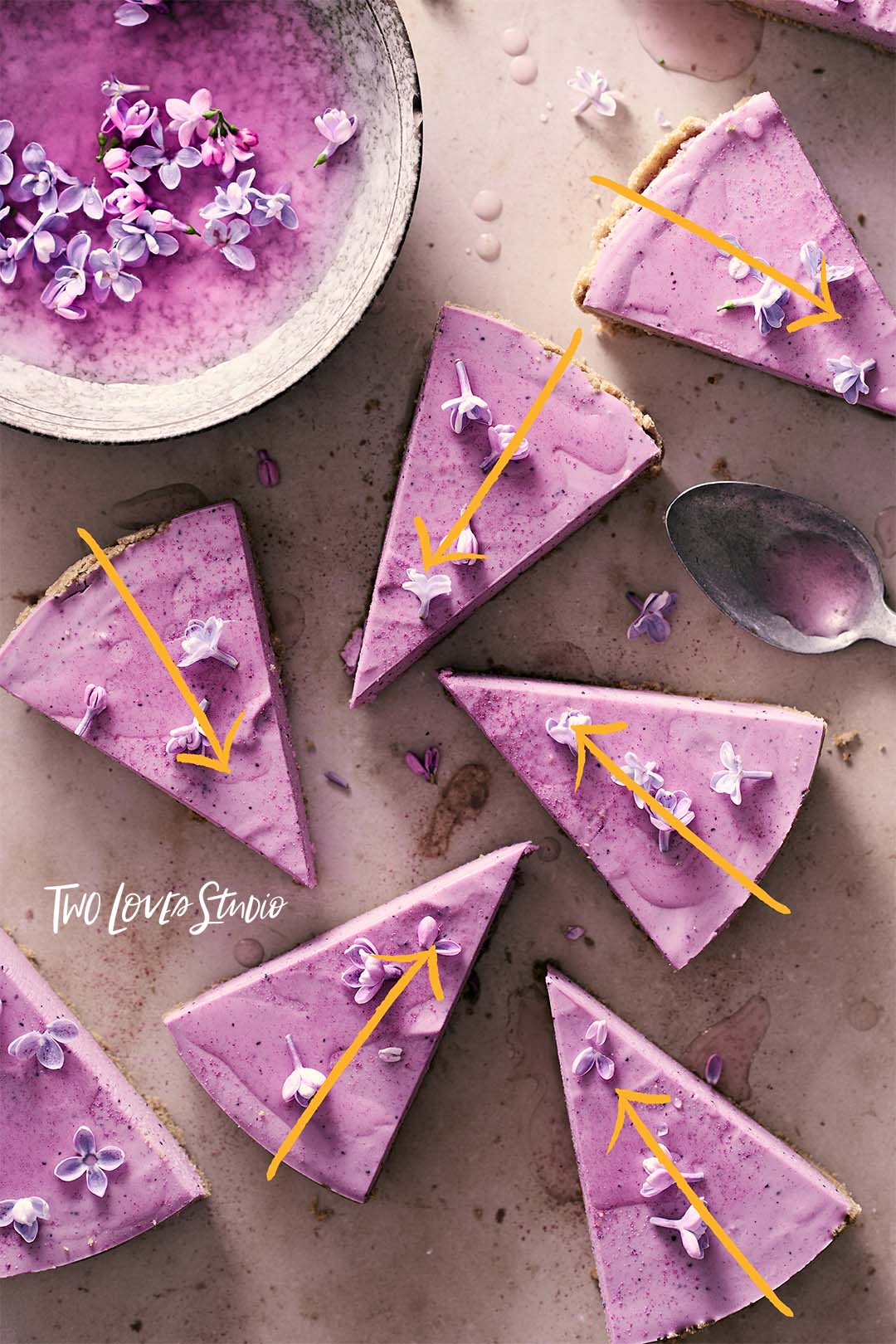 Blueberry lilac tart slices with arrows demonstrating a composition secret in food photography