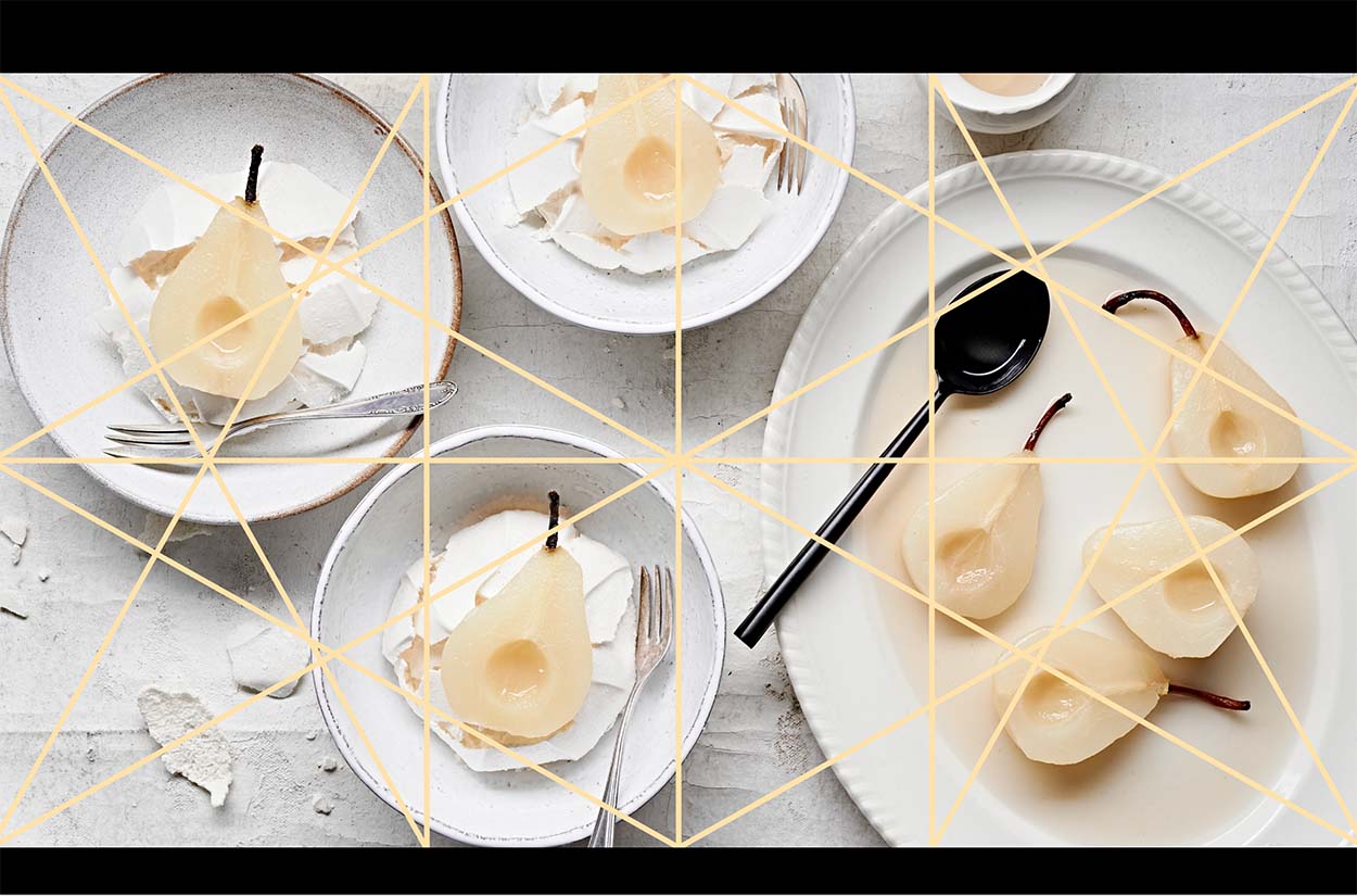 Dynamic symmetry lines over a photo of poached pears and meringue.