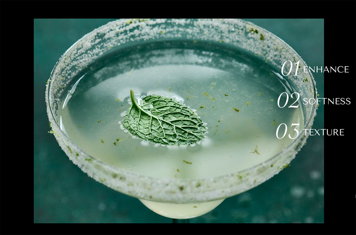 A cucumber margarita with text on the photo about why we use clarity editing tools.