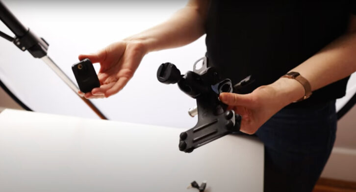 Demonstrating a remote control in a cold shoe for photography.