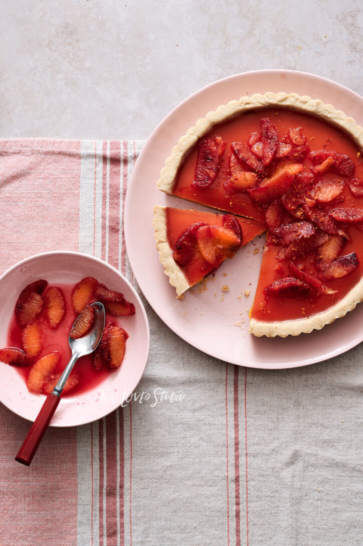 Blood orange tart with segments and  zest. Showing food photographers how to shoot food photography.